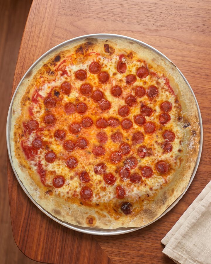 Hot pepperoni pizza slice at Pizza 8 on Calle Ocho, Miami